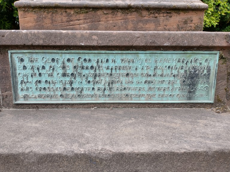 Plaque at base of cross